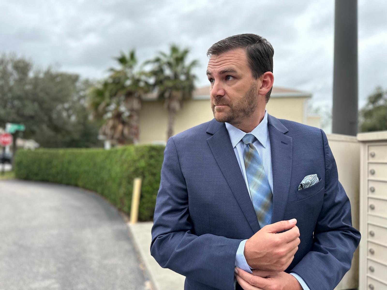 man in blue suit and shirt